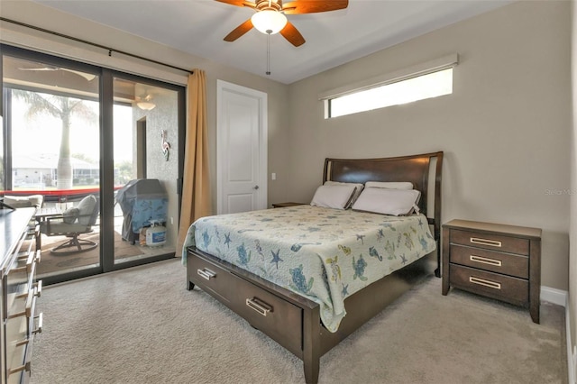 bedroom with access to exterior, light carpet, and ceiling fan