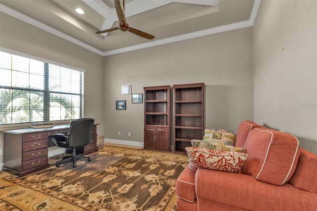 home office featuring a tray ceiling, ceiling fan, and crown molding