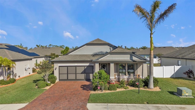 15292 Mille Fiore Blvd, Port Charlotte, FL 33953 - view of front of house with a front lawn, covered porch, and a garage