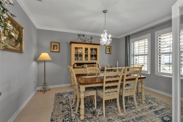 tiled dining space featuring an inviting chandelier and ornamental molding