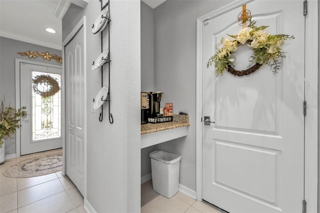 doorway featuring light tile patterned flooring