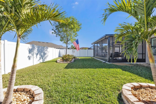 view of yard featuring a sunroom