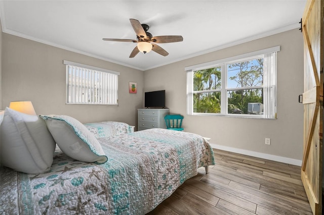 bedroom with ceiling fan, hardwood / wood-style flooring, and ornamental molding