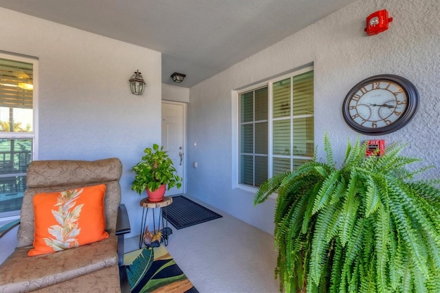 14070 Heritage Landing Blvd Unit 423, Punta Gorda, FL 33955 - view of exterior entry with stucco siding and a porch
