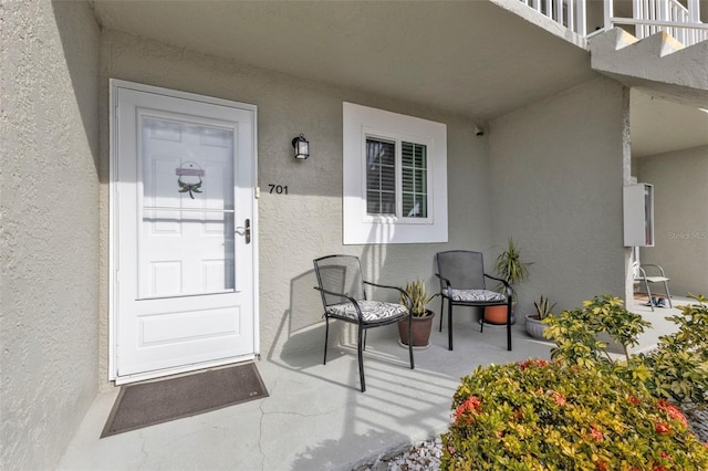 entrance to property with a balcony