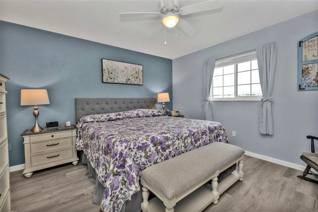 bedroom featuring light hardwood / wood-style flooring and ceiling fan