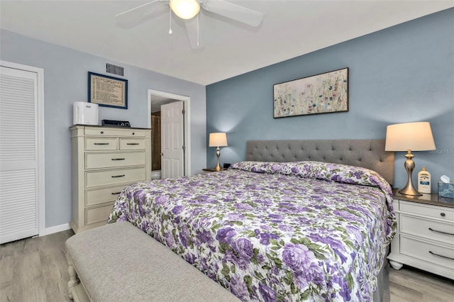 bedroom featuring a closet, ceiling fan, and light hardwood / wood-style flooring