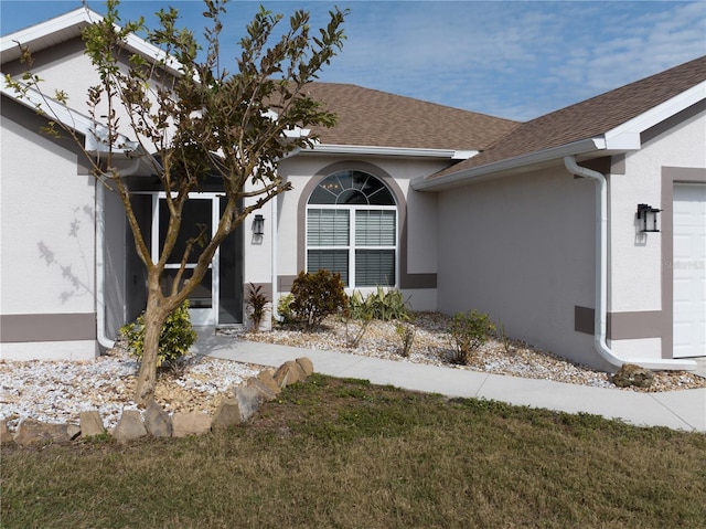 entrance to property with a yard