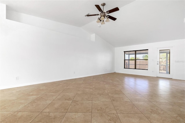 unfurnished room featuring ceiling fan, light tile patterned floors, and vaulted ceiling