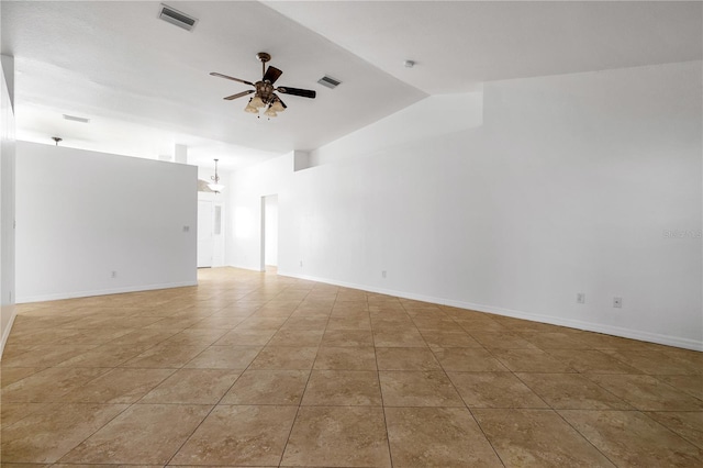 empty room with ceiling fan, light tile patterned floors, and lofted ceiling