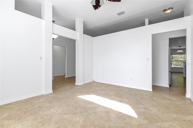 unfurnished room with ceiling fan