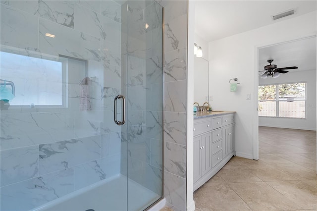 bathroom featuring ceiling fan, a shower with door, vanity, and tile patterned flooring