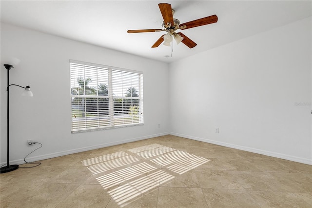 tiled empty room with ceiling fan