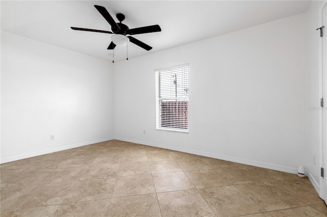 tiled empty room with ceiling fan