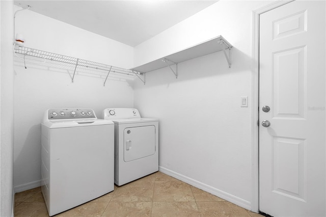 washroom featuring washer and clothes dryer