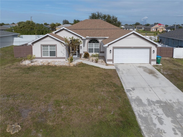 single story home with a garage and a front yard