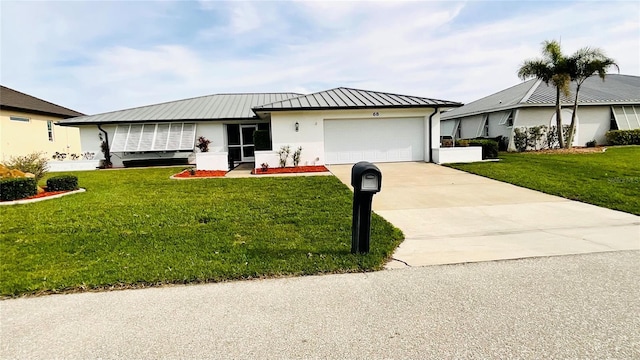 view of front of house featuring a garage and a front yard