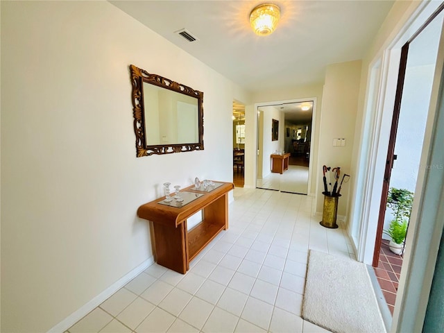 corridor with light tile patterned flooring