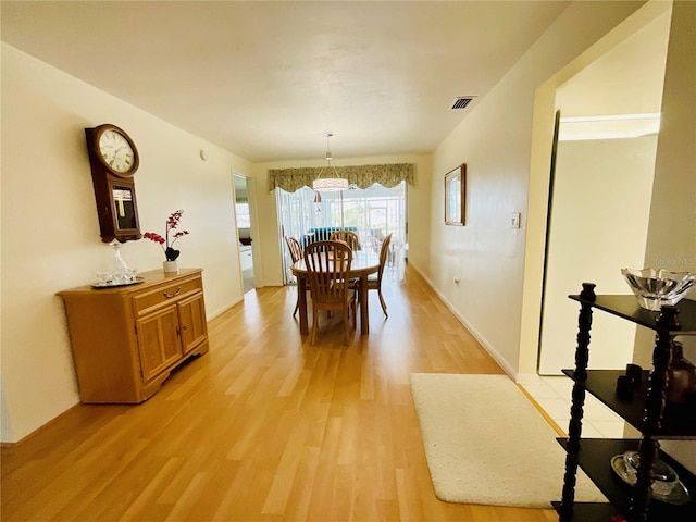 dining space featuring light hardwood / wood-style floors