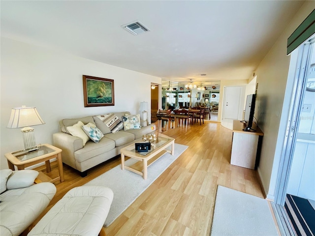 living room with light hardwood / wood-style floors