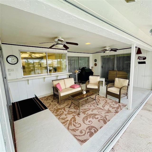 view of patio featuring an outdoor living space and ceiling fan