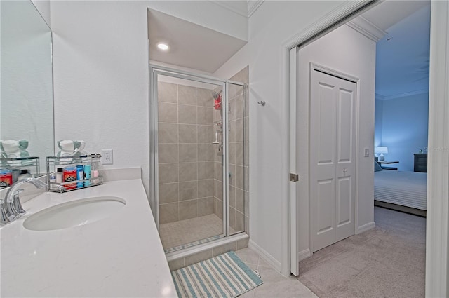 bathroom with vanity and a shower with door