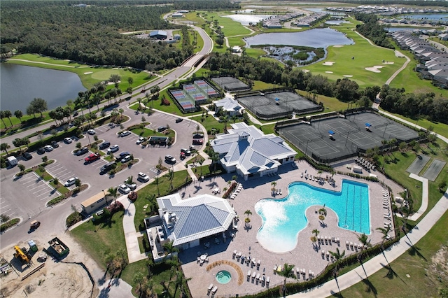 birds eye view of property with a water view