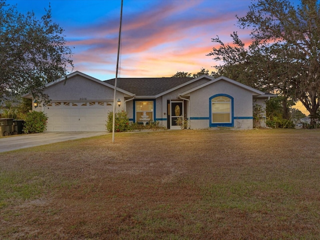 ranch-style home featuring a garage