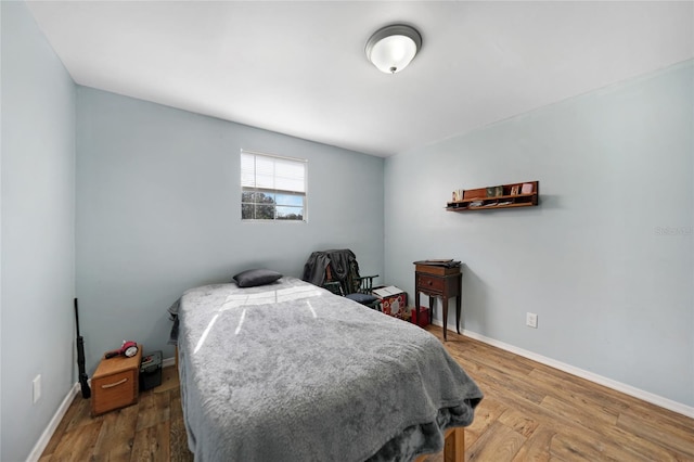 bedroom featuring wood-type flooring