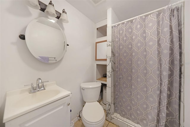 bathroom featuring vanity, toilet, and curtained shower