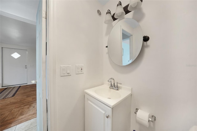 bathroom with tile patterned flooring and vanity