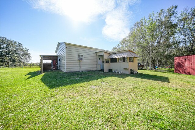 back of property featuring a yard