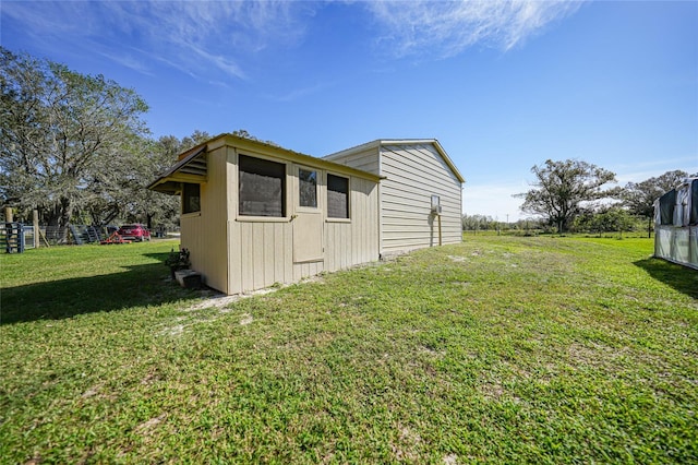 view of side of home featuring a lawn