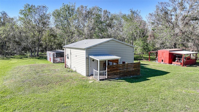 view of outdoor structure with a lawn