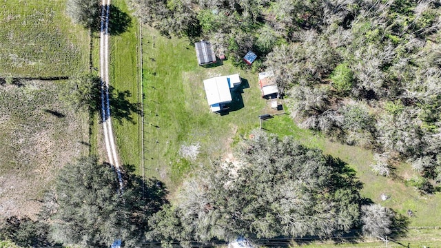 birds eye view of property with a rural view