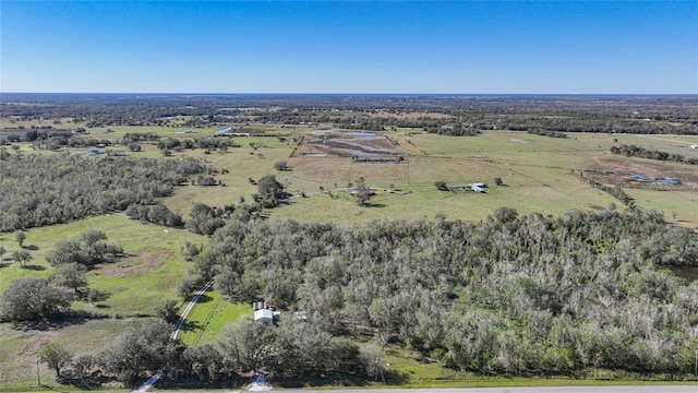 birds eye view of property with a rural view