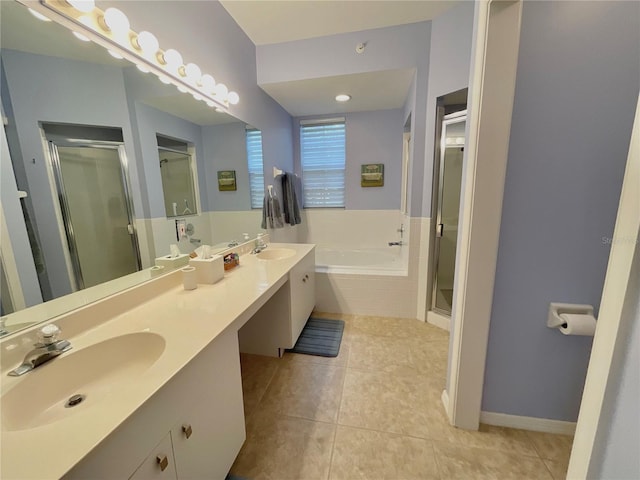 bathroom with tile patterned floors, vanity, and independent shower and bath