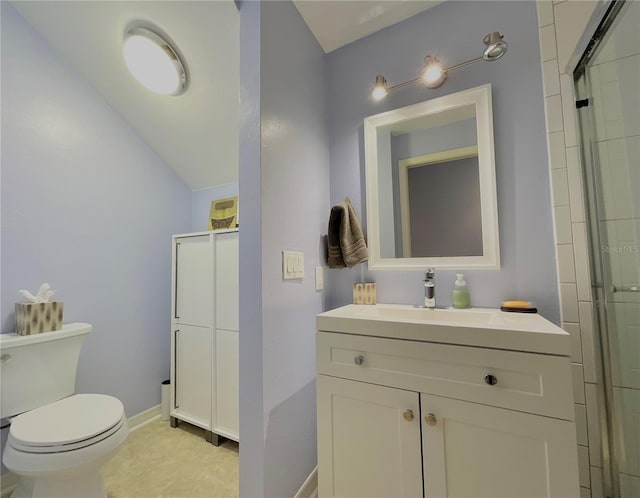 bathroom featuring vanity, toilet, and walk in shower