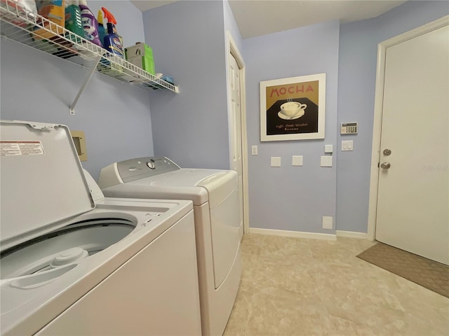 washroom featuring washer and dryer