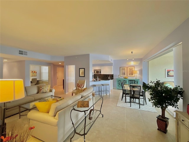 living room with light tile patterned floors