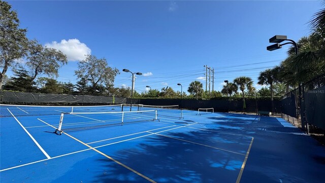 7750 Gardner Dr Unit 102, Naples, FL 34109 - view of tennis court featuring fence