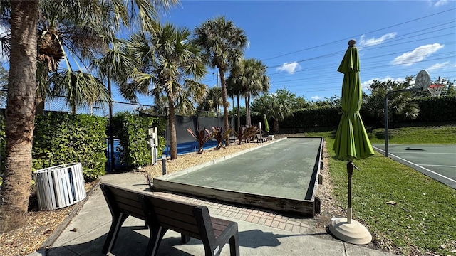 7750 Gardner Dr Unit 102, Naples, FL 34109 - view of home's community with basketball court and a yard