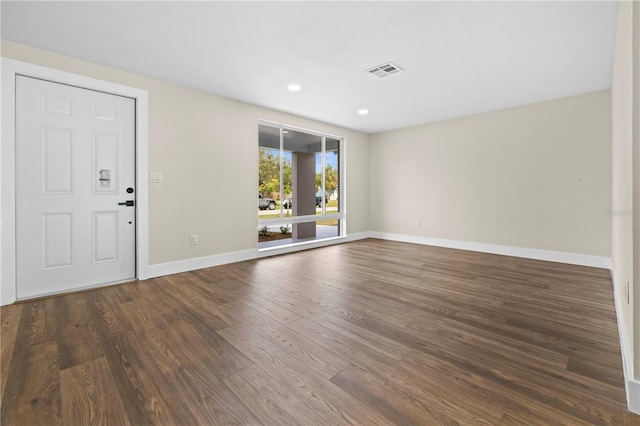 interior space with dark hardwood / wood-style flooring