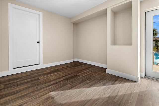 spare room with hardwood / wood-style floors