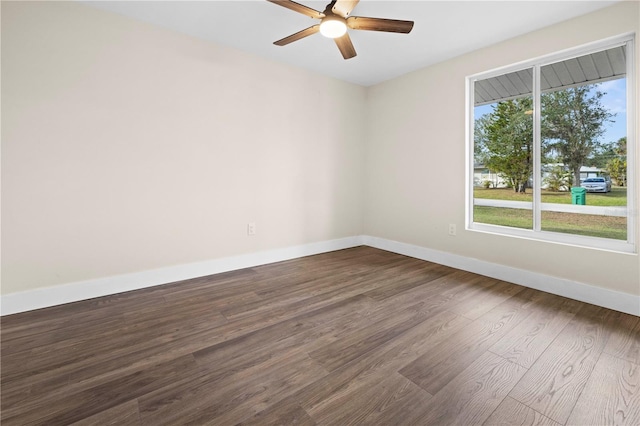 spare room featuring hardwood / wood-style flooring and ceiling fan