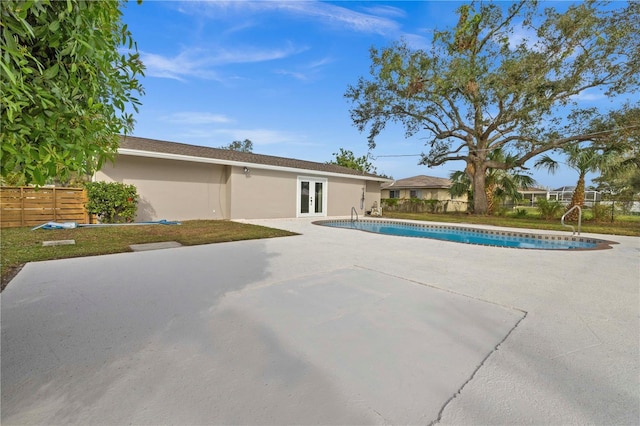 view of pool featuring french doors and a patio