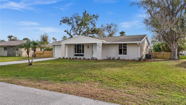 single story home with central AC unit, a garage, and a front lawn