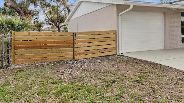 view of side of property with a garage