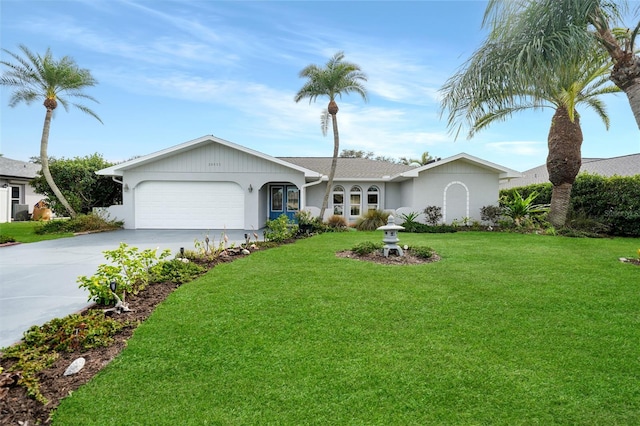 ranch-style home with a front lawn and a garage