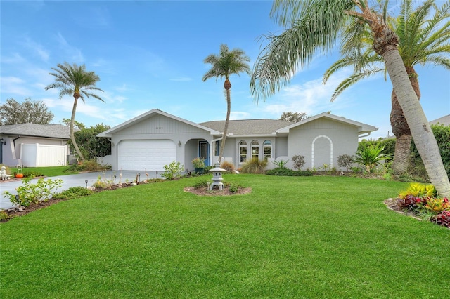 ranch-style home featuring a front lawn and a garage